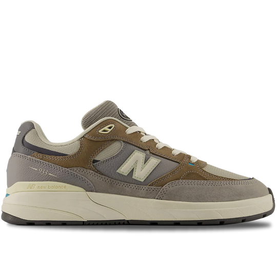 Brown and gray sneaker with New Balance logo on a white background