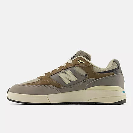 Brown and gray sneaker with New Balance logo on a white background