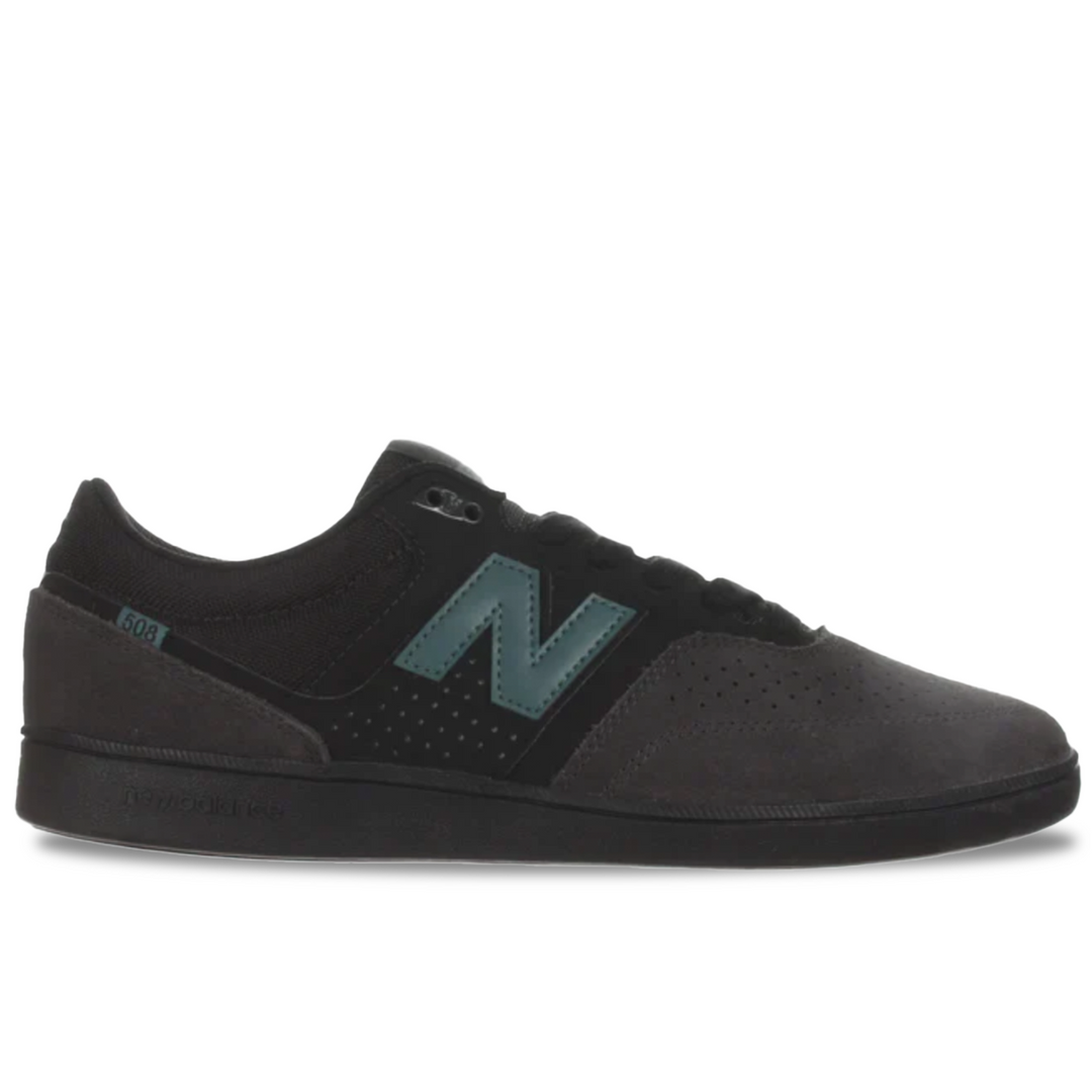 Black sneaker with a green 'N' logo on a white background