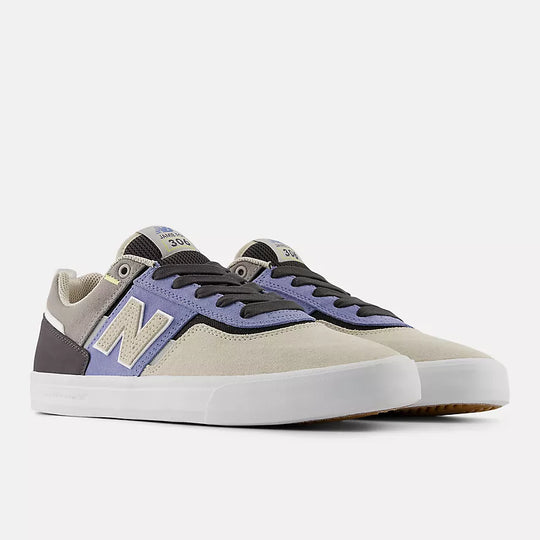 Pair of sneakers with a purple and gray design on a white background