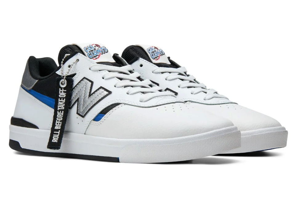 White sneaker with black and blue accents on a white background