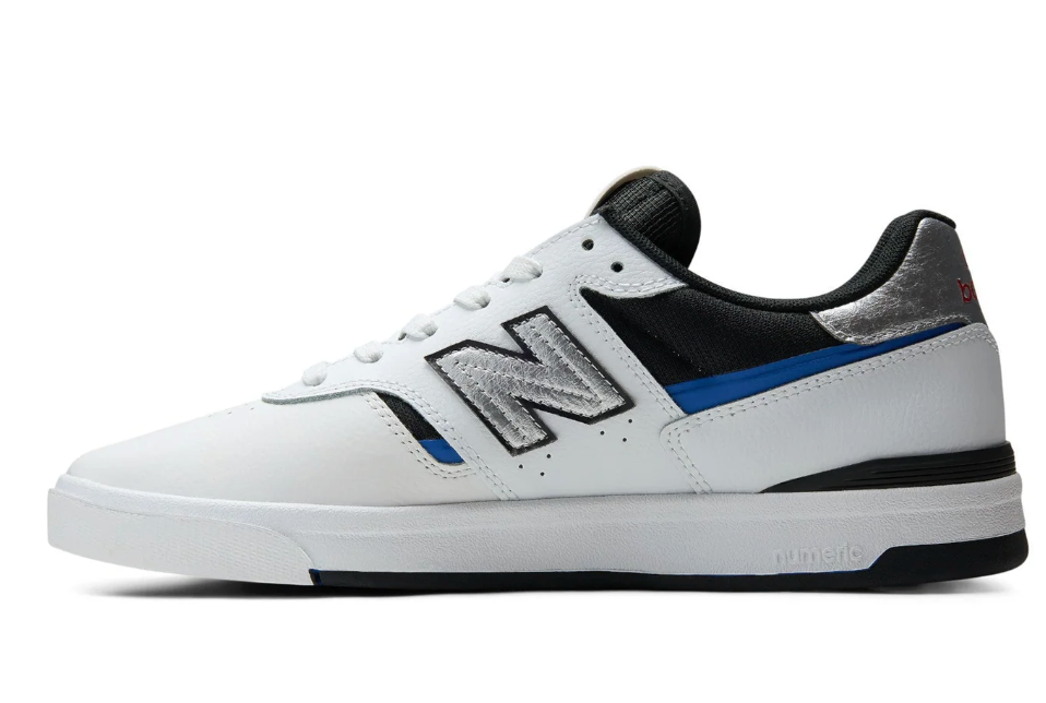 White sneaker with black and blue accents on a white background