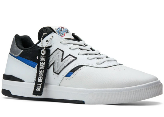 White sneaker with black and blue accents on a white background