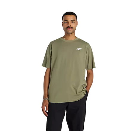 Man wearing a green t-shirt with a brand logo on a white background