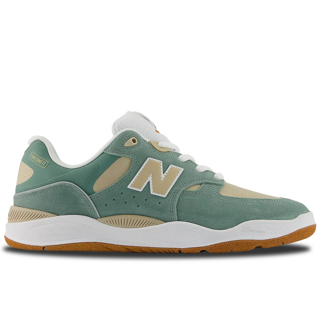 Green and beige sneaker with New Balance logo on a white background