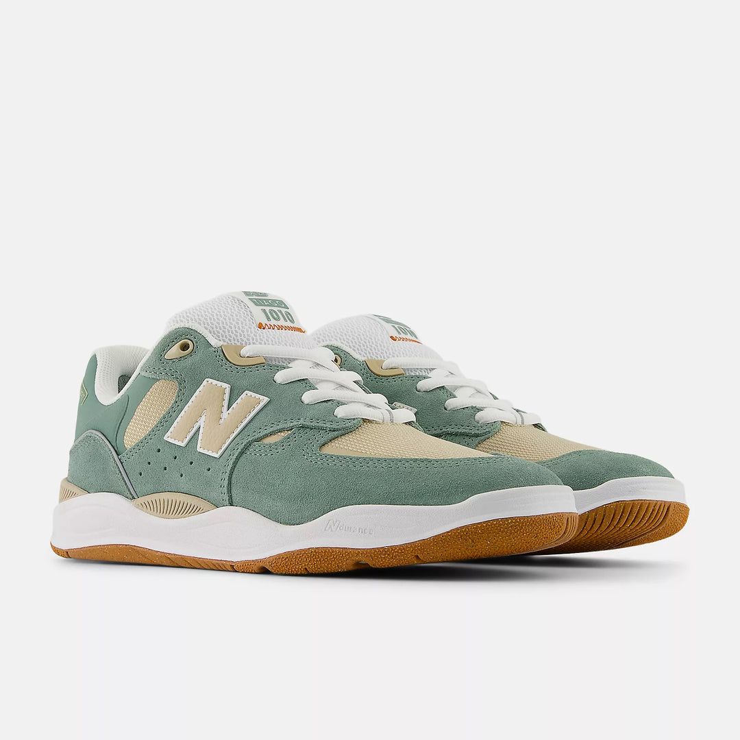 Green and beige sneaker with white sole on a white background