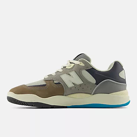 Multicolor sneaker with New Balance logo on a light gray background