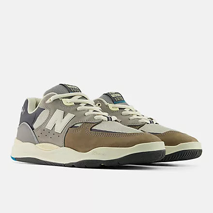 Gray and brown sneakers with New Balance logo on a white background