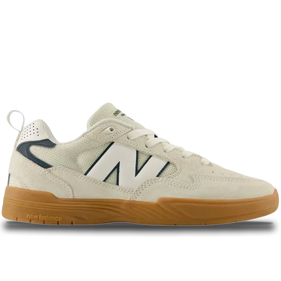 Beige sneaker with brown sole on a white background