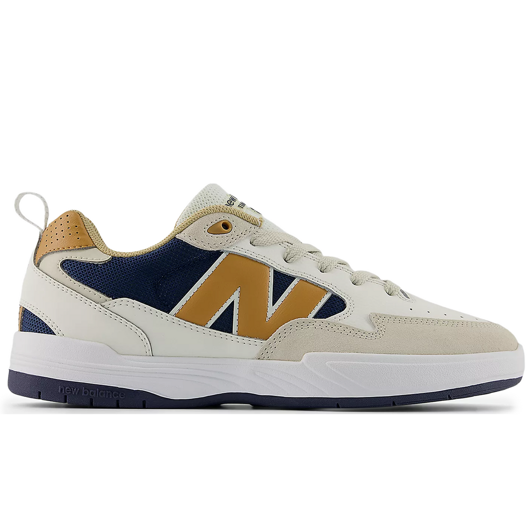New Balance Sneaker with a white, blue, and brown color 