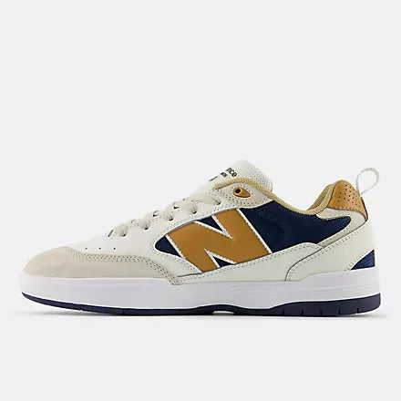 Sneaker with white, brown, and navy design on a white background