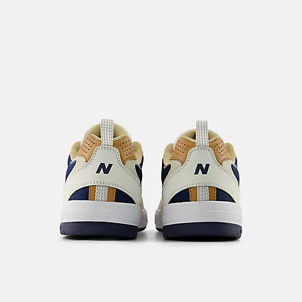 Pair of New Balance sneakers shown from the back with reflective heel