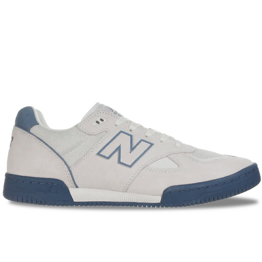 White sneaker with blue accents on a white background