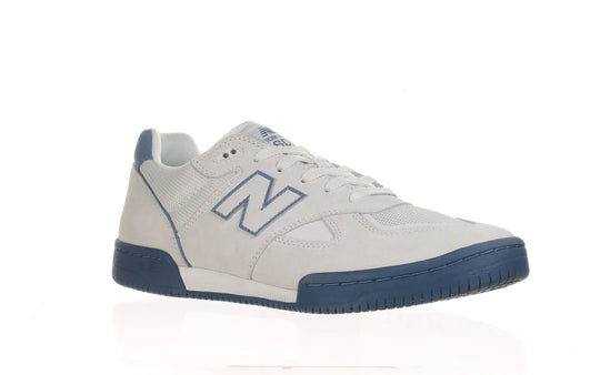 White sneaker with blue accents on a white background