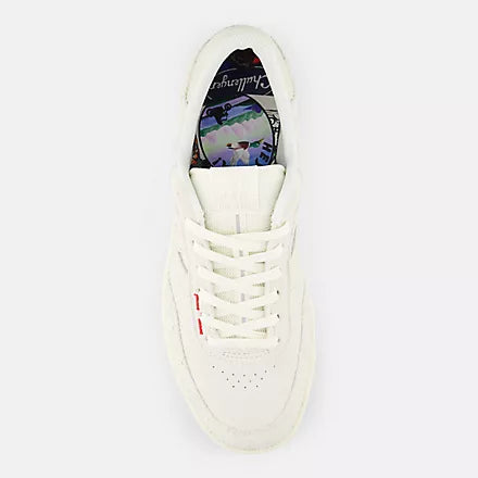 White sneaker with colorful interior on a white background