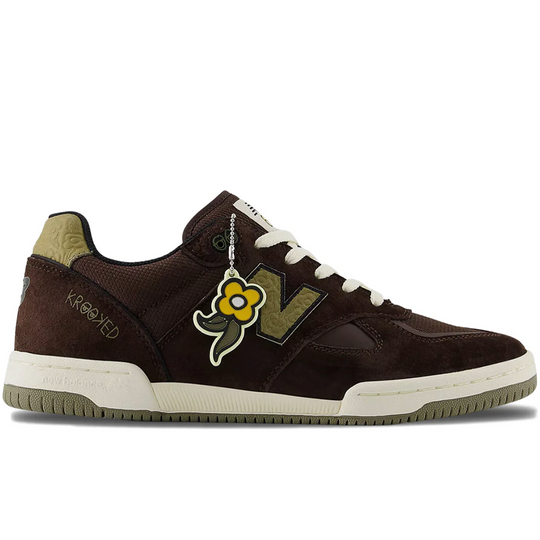 Brown sneaker with a floral design and white sole and krooked logo on the heel