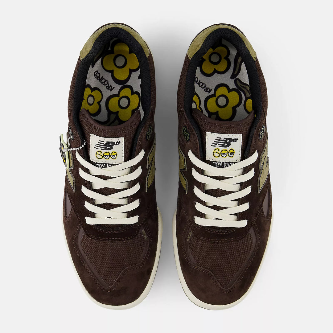 Brown tom knox sneakers with white laces and floral designs 