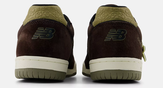Brown and green New Balance sneakers with krooked gonz flowers on the heel
