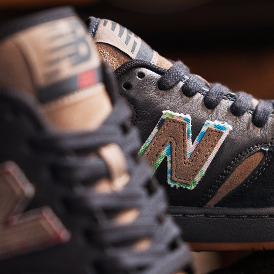 Close-up of a New Balance sneaker with a focus on the brand logo.