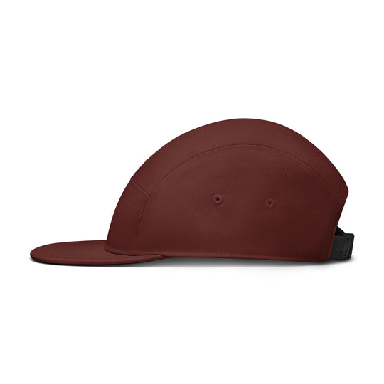 A dark burgundy five-panel cap with a flat brim and a black adjustable strap, shown from a side profile on a white background.
