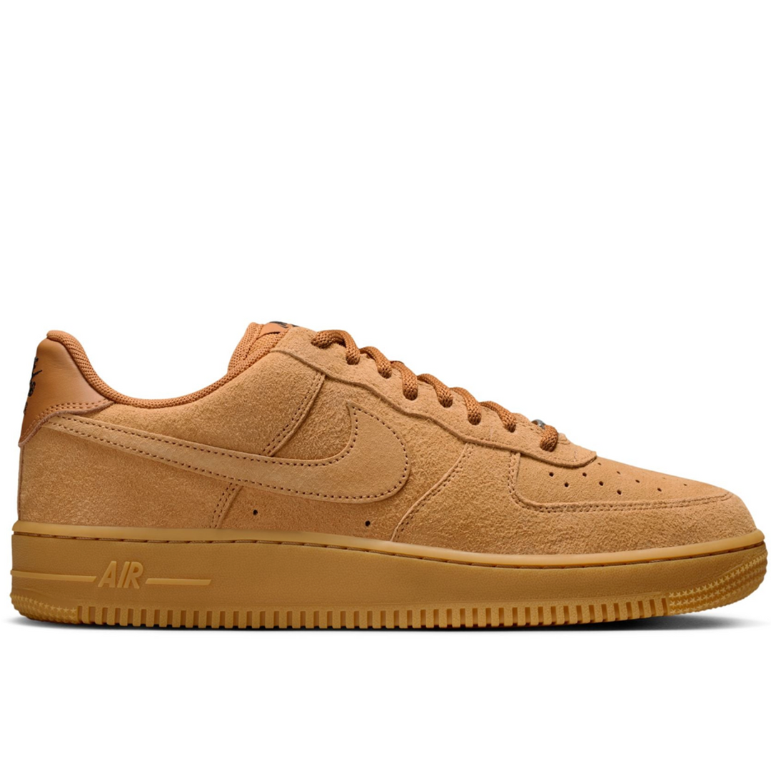 Tan sneaker with Nike logo on a white background