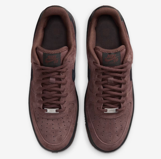 A pair of Nike SB Air Force 1 Low sneakers in a dark brown suede and leather combination, shown from a top-down view on a light gray background.