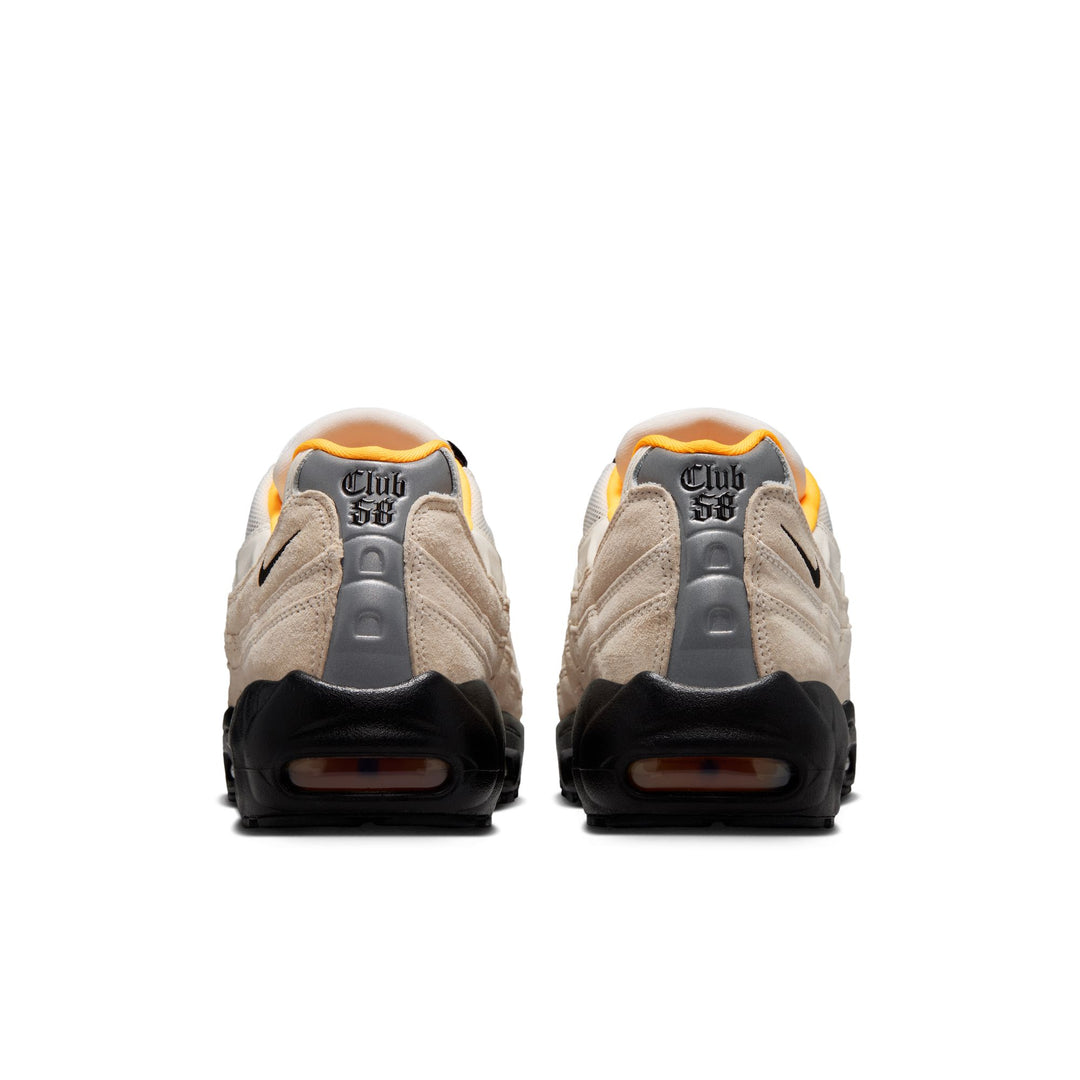 Pair of beige and gray sneakers with &