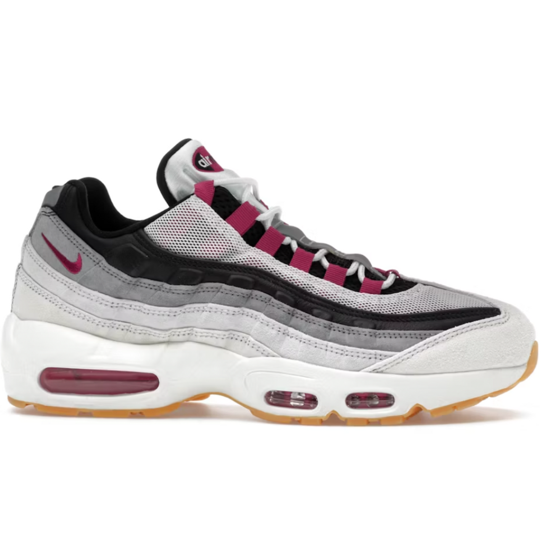 Gray and black sneaker with red accents on a white background