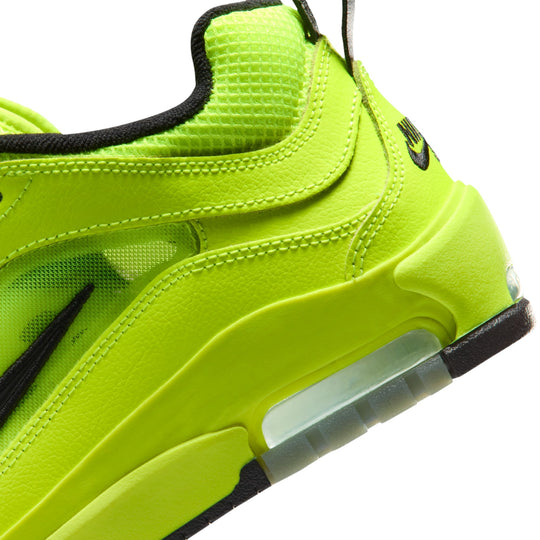 Neon green sneaker with black accents on a white background