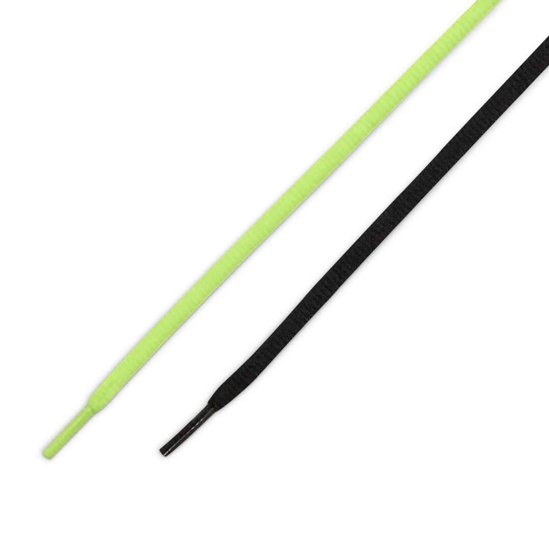 Two shoelaces, one green and one black, on a white background.