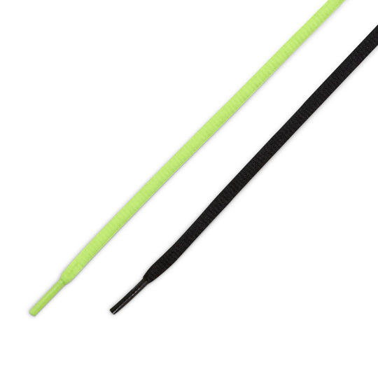 Two shoelaces, one green and one black, on a white background.