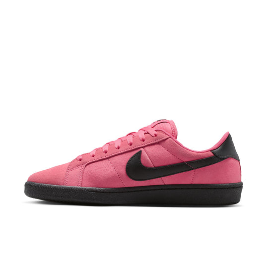 Pink sneaker with black swoosh logo on a white background