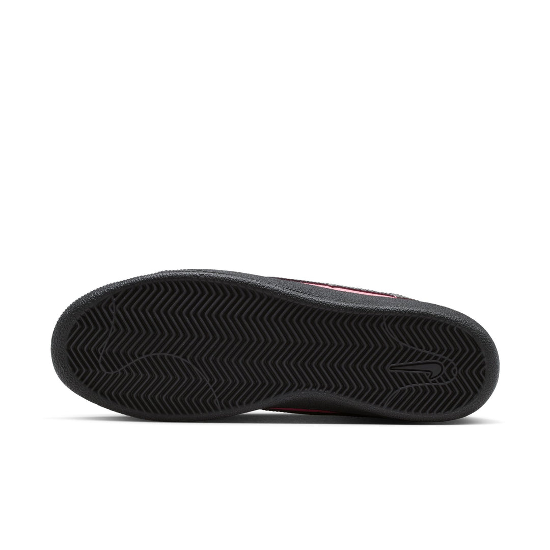 Black cleated shoe sole on a white background