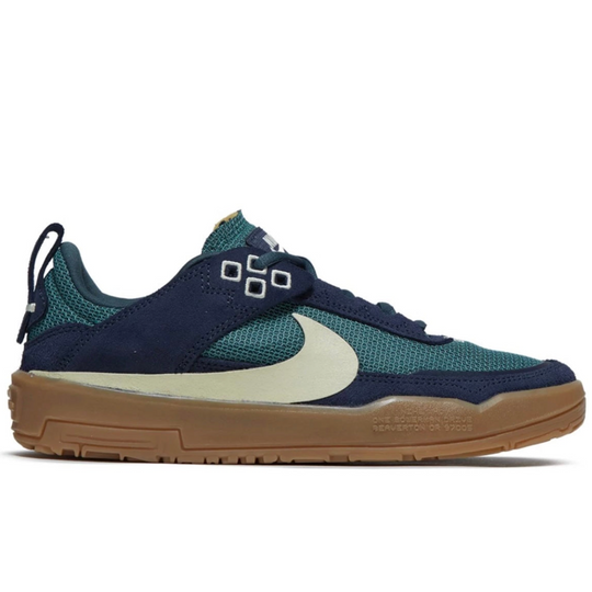 Navy and teal sneaker with a white swoosh logo 