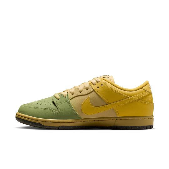 A Nike Dunk Low sneaker in a green and yellow colorway, featuring an olive green leather toe box, a yellow leather midfoot Swoosh and heel, and a tan gum outsole, shown from a side profile on a white background.