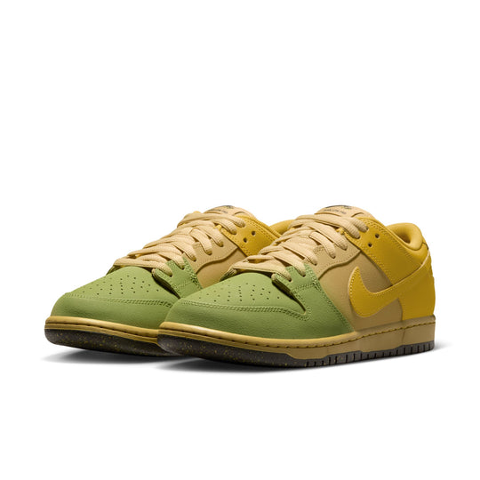 A pair of Nike Dunk Low sneakers in olive green and yellow, featuring a green leather toe box, yellow overlays, and matching yellow laces, set against a plain white background.