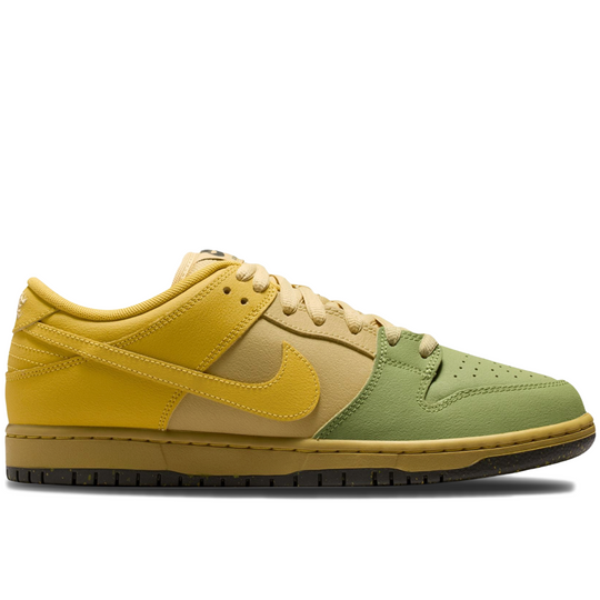 A Nike low-top sneaker in a color-blocked yellow, tan, and sage green design, shown from a side profile on a white background.