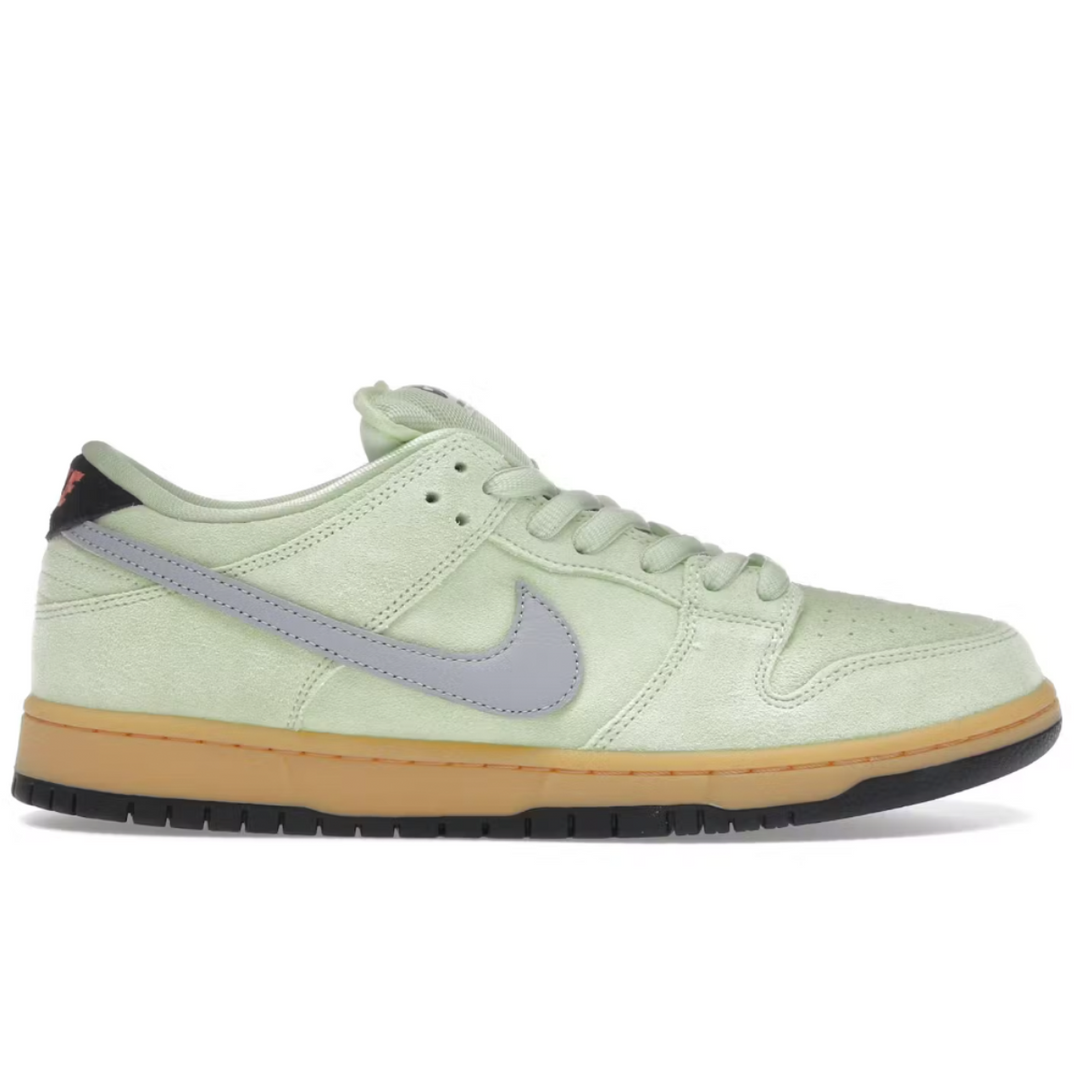Light green sneaker with a gray swoosh logo on a white background