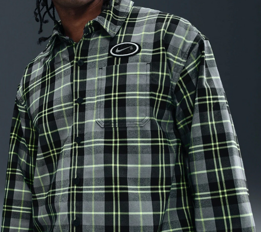 Plaid shirt with a nike brand logo on a dark background