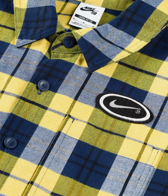 Plaid shirt with Nike logo and branding on a close-up view