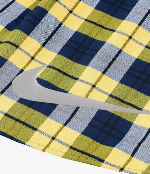 Plaid fabric with a Nike logo in the center