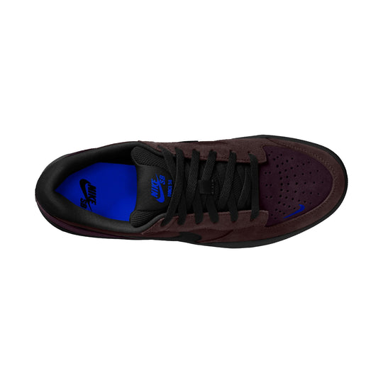 A Nike Air Force 1 sneaker shown from a top-down view, featuring a dark burgundy suede upper, black laces, black mesh panels, and a vibrant blue Nike logo and interior lining.