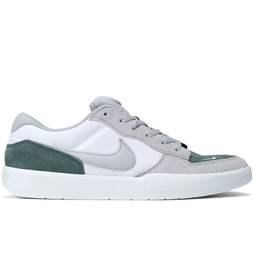 green white and gray FORCE 58 sneaker with a Nike logo 