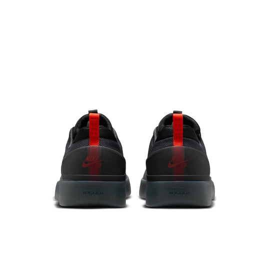 Black sneakers with red accents on a white background