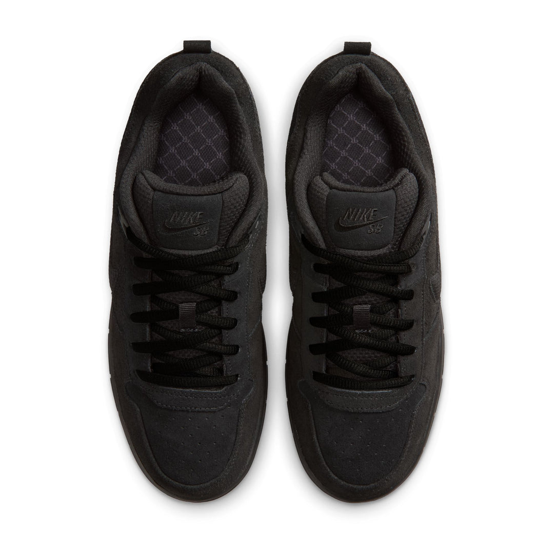 Pair of black Nike sneakers on a white background
