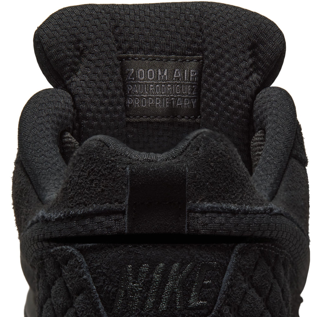 Close-up of a black Nike glove with &