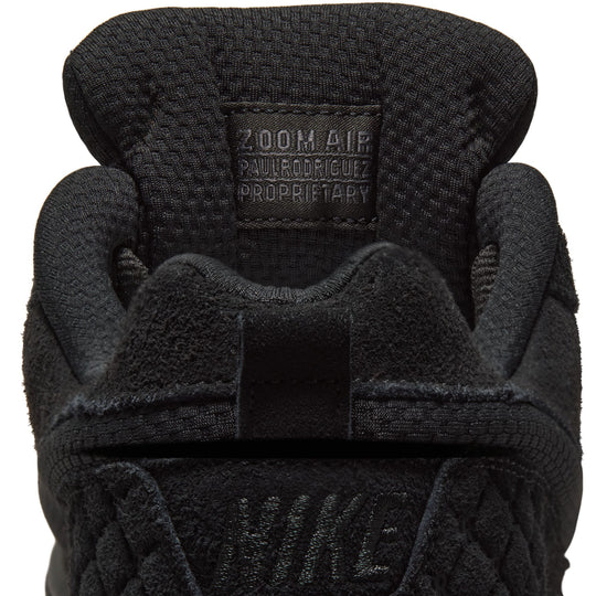 Close-up of a black Nike glove with &