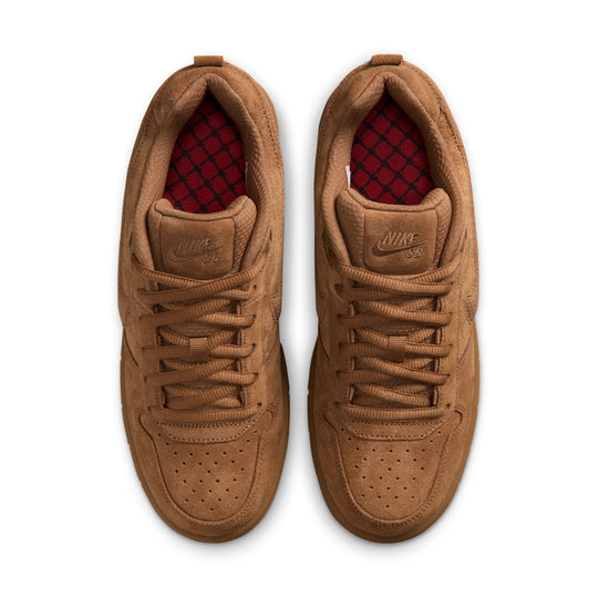 A pair of Nike Air Force 1 Low sneakers in a monochromatic tan/brown suede and leather upper, featuring a red patterned lining visible inside the collar, shown from a top-down view on a white background.