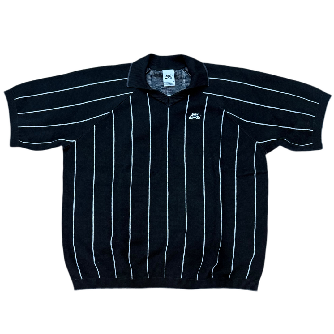 Black polo shirt with white stripes on a white background