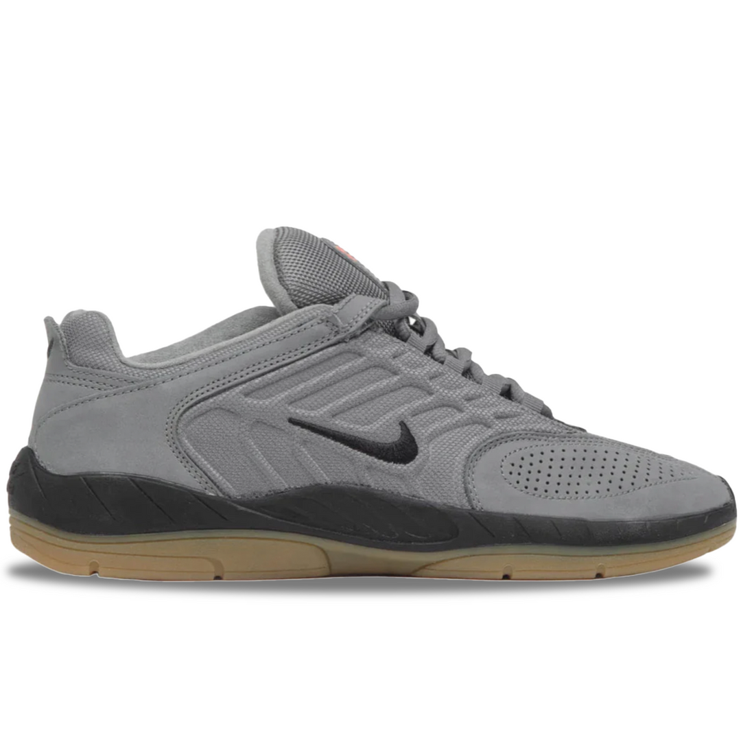 Gray athletic shoe with black swoosh logo on a white background